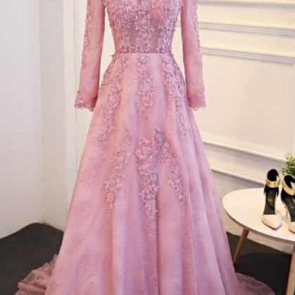 A Pink Lace Long-sleeved Evening Gown With Long,..