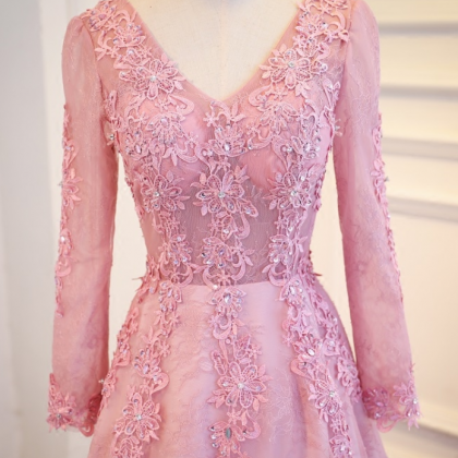 A Pink Lace Long-sleeved Evening Gown With Long,..