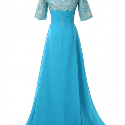 A Blue Evening Dress With A Short Sleeveless..