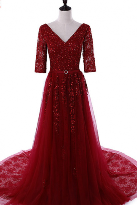 The Red Long Sleeve Ball Gown Was Formally Dressed In A Formal Evening Gown